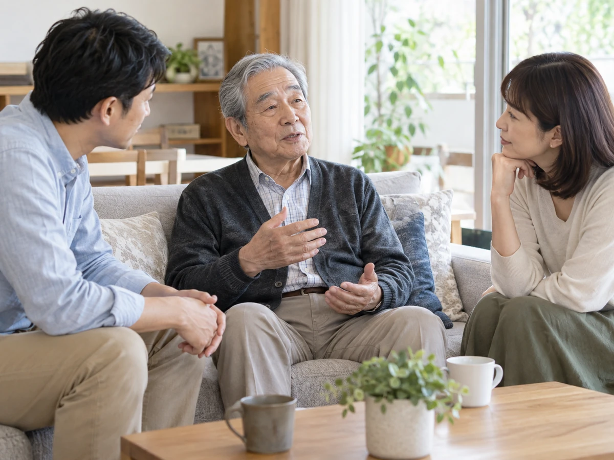 自宅のソファで父親の希望を息子と娘が落ち着いて聞いているイメージ